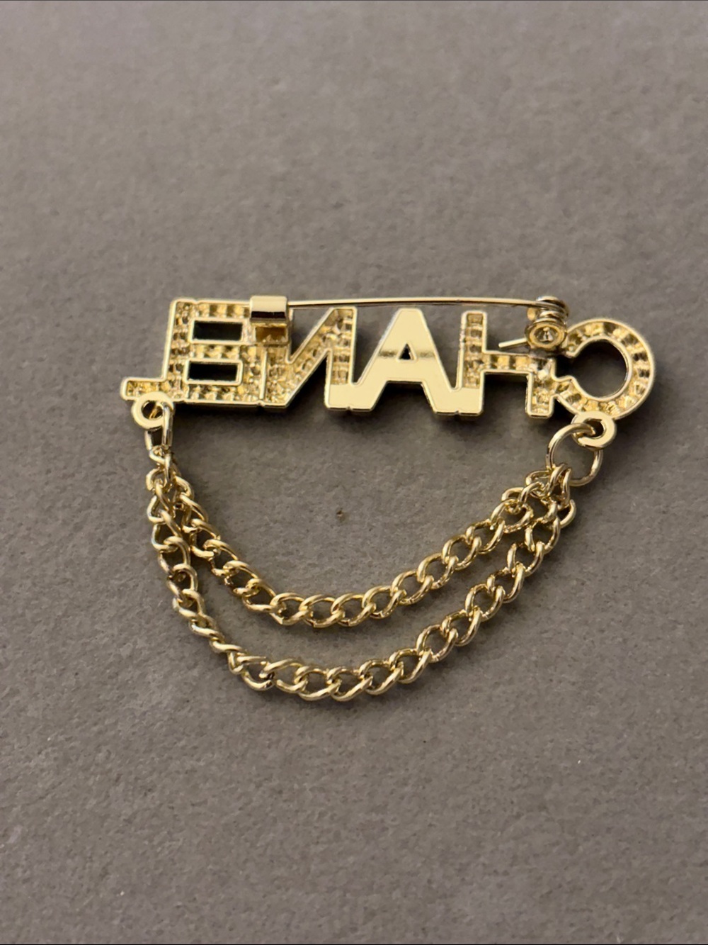 Gold-Tone Crystal Logo Chain Brooch - Picture 2 of 3